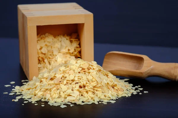 Cornflakes in wood box on a dark wooden background and copy