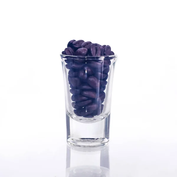 Fresh roasted beans in glassware on background. — Stock Photo, Image