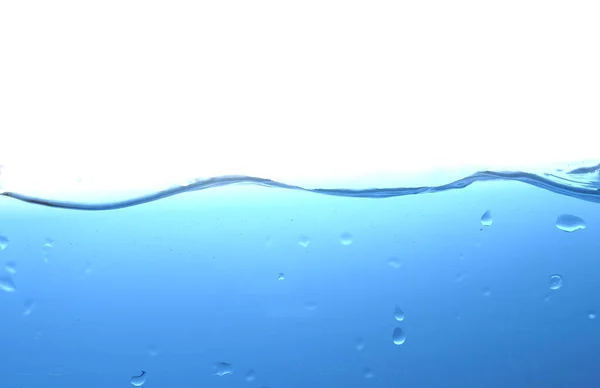 Salpicadura de agua u ola de agua con burbujas de aire en el fondo —  Fotos de Stock