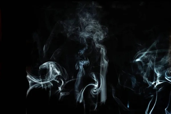 Abstract white smoke effect isolated on black background. — Stockfoto