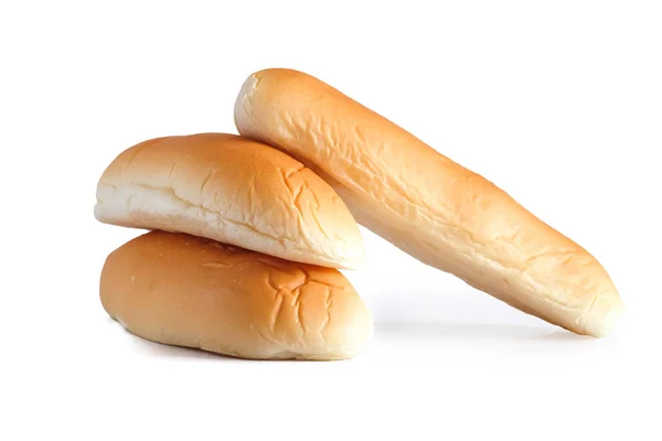 Loafs of fresh hot bread out of the oven on white background. — Stockfoto