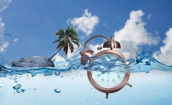 A  alarm clock  into water with a rocky island and coconut tree