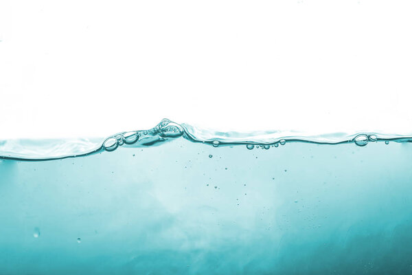 Water splash or water wave with bubbles of air on the background