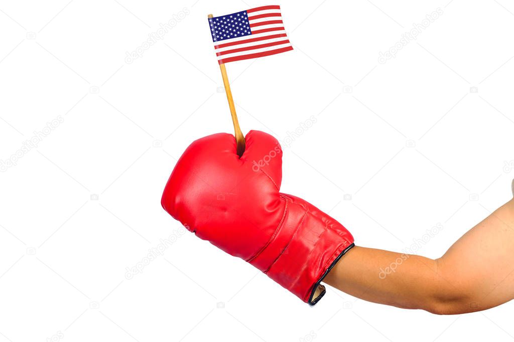 Red leather boxing gloves hold a small flag on white.