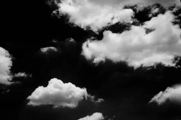 Black sky with white cloud on background, nature concept.