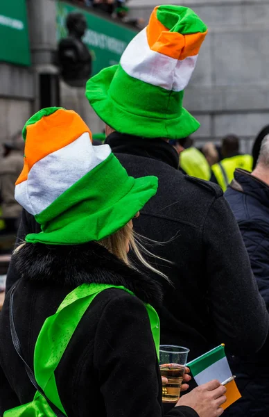 People celebrating St. Patrick day in Trafalgar Square in London
