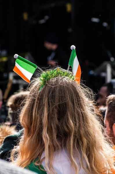 People celebrating St. Patrick day in Trafalgar Square in London