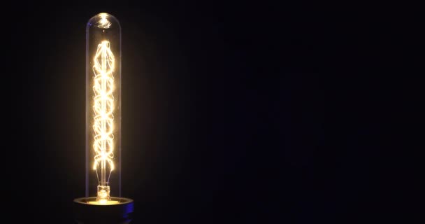 Glowing Vintage Light Bulb Black Background Turning Lamp Flickering Light — Stock Video
