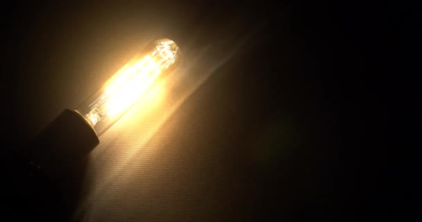 Glowing Vintage Light Bulb Black Background Turning Lamp Flickering Light — Stock Video