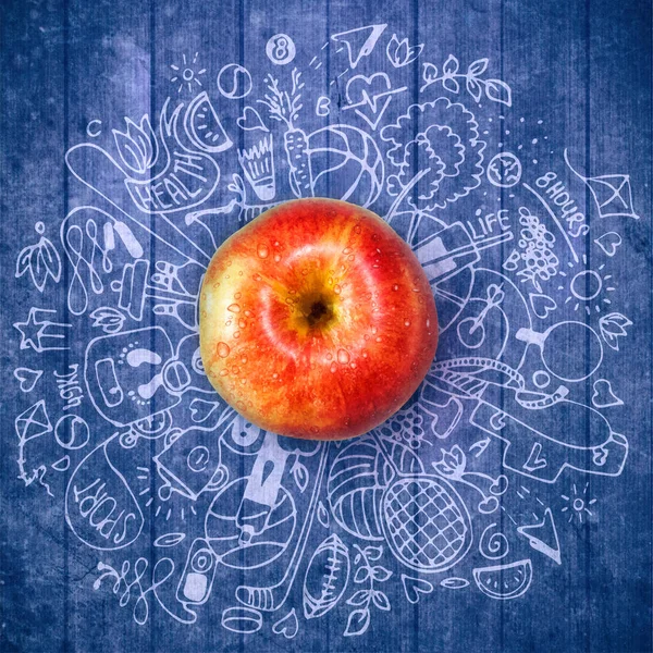 Healthy lifestyle concept with apple and doodles — Stock Photo, Image