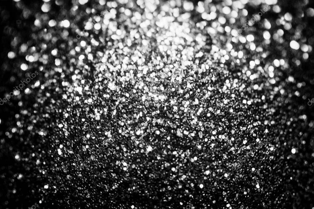 Black glitter sparkle background. Black friday shiny pattern with