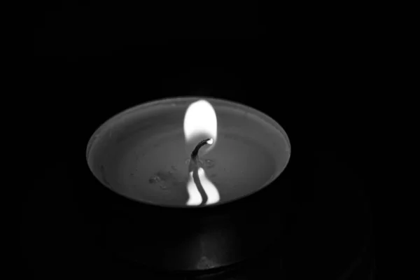 Flame reflected in wax, black and white