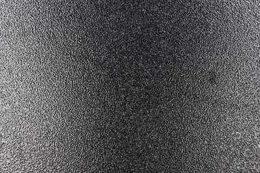 Ortasında gölge olan metal kapının dokusu..