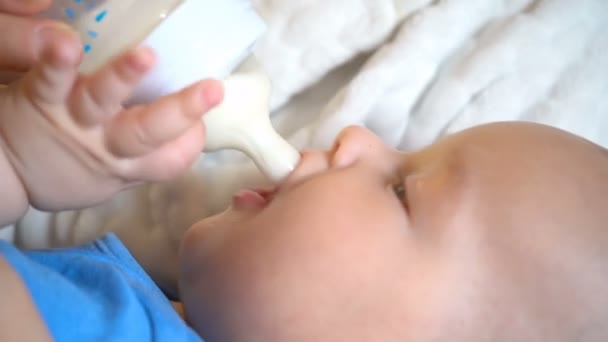 Close Child Eating Bottle — Stock Video