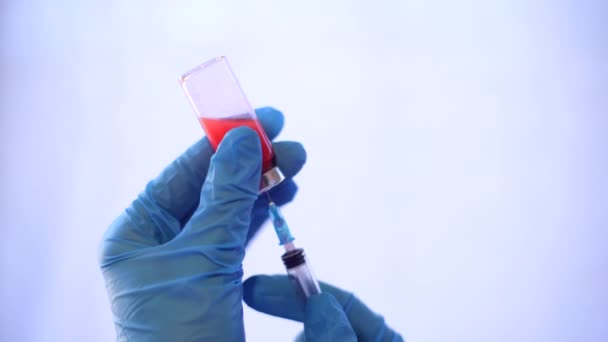 Hospital Medicine Doctor Fills Syringe Red Liquid Vial Closeup Doctor — Stock Video