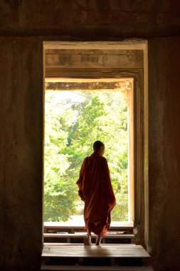 January 3rd 2017, Cambodia, Buddhist monk coming out of one of the doors of the Angkor Wat