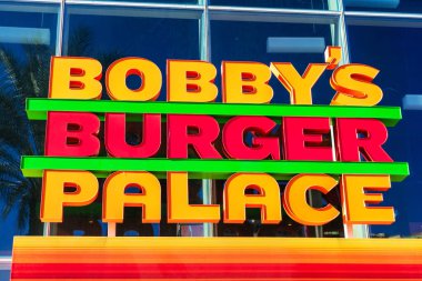 Bobby 'nin Burger Palace tabelası lüks bir fast food restoranının reklamını yapıyor.