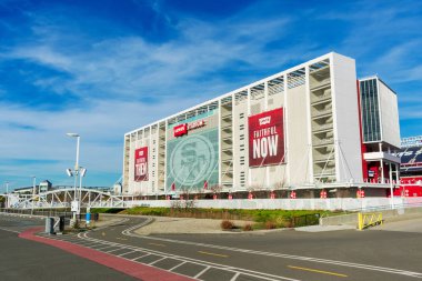 Levi's Stadium home of the San Francisco 49ers of the National Football League with white steel pedestrian bridge spanning San Tomas Creek clipart