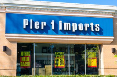 Pier 1 Imports store facade with sale discounts due to the closing of the store. The chain declares bankruptcy and files for Chapter 11 protection