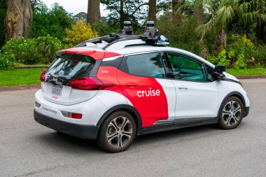 Self-driving Chevrolet Bolt by Cruise Automation undergoing testing in San Francisco. The vehicle is equipped with numerous Velodyne LiDAR sensors - San Francisco, CA, USA - 2020 clipart