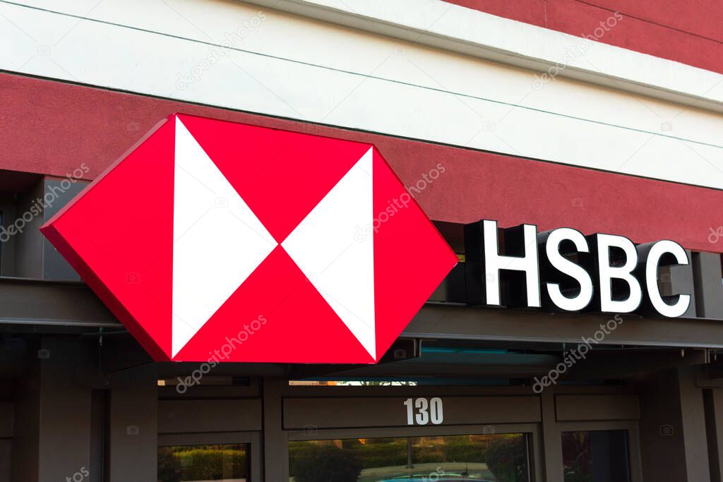 HSBC logo at a bank branch. HSBC Holdings plc is a British multinational investment bank and financial services holding company - Cupertino, California, USA - 2020