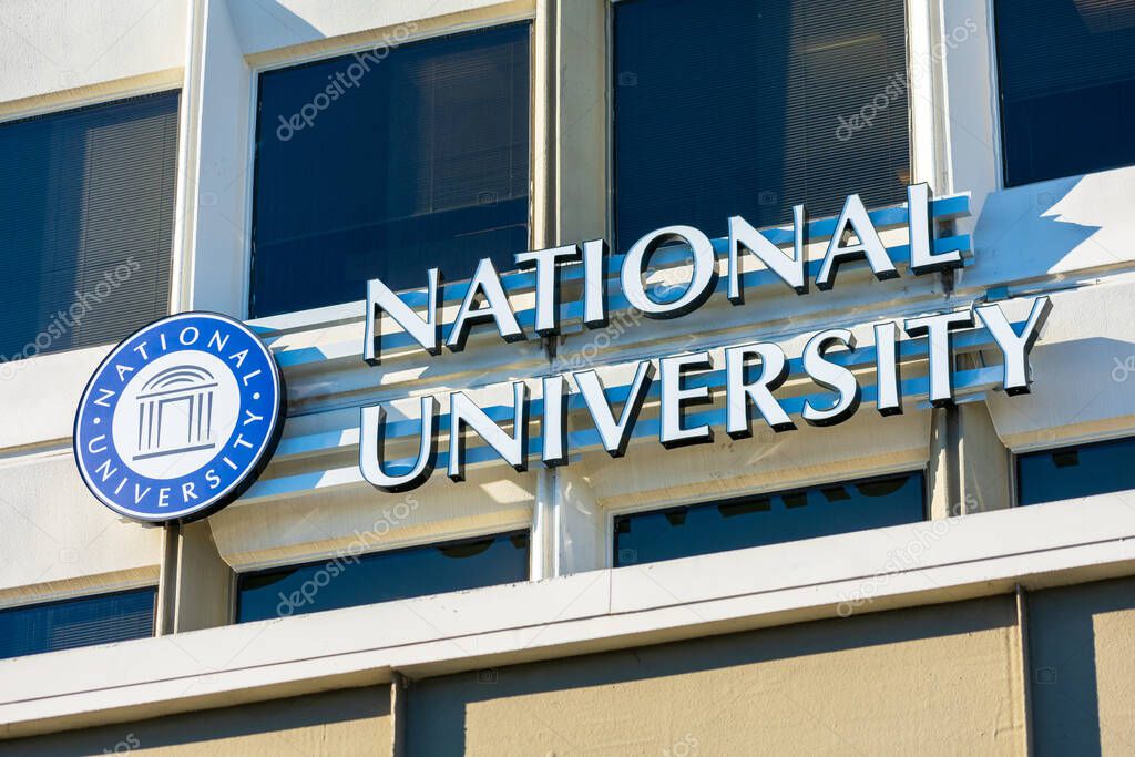 National University sign on a Silicon Valley campus of a private university with programs designed for adult learners - San Jose, California, USA - 2020