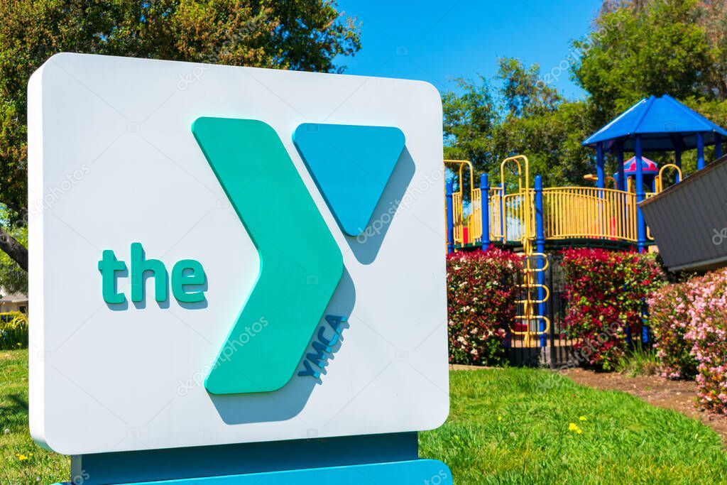 YMCA sign at nonprofit organization club location offering child care service - San Jose, California, USA - 2020