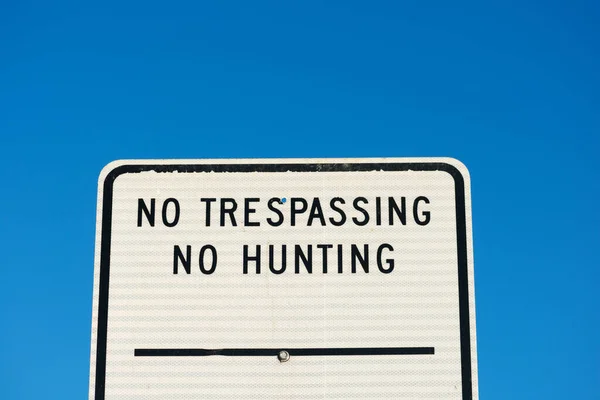 Trespassing Hunting Sign Blue Sky Background Close — Stock Photo, Image