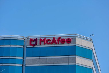 McAfee logo and sign on Silicon Valley headquarters of global computer security software company - Santa Clara, California, USA - May 11, 2019 clipart
