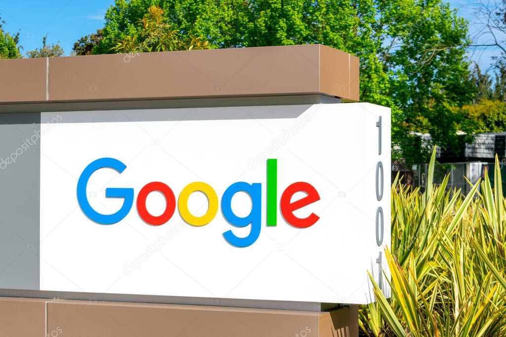 Close up. Google logo on signpost near multinational technology company office - Mountain View, California, USA - 2020