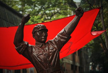 Bronze statue of soviet working man clipart