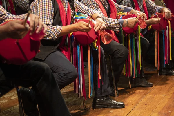 Men playing the drum, traditional spanish christmas instrument