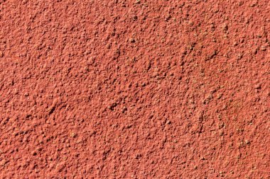 Kırmızımsı turuncu renkli yüksek kontrastlı ve derin beton arka plan dokusu