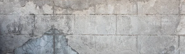 Texture of a concrete block wall. Grunge texture of concrete blocks for designers. Block of rough masonry.