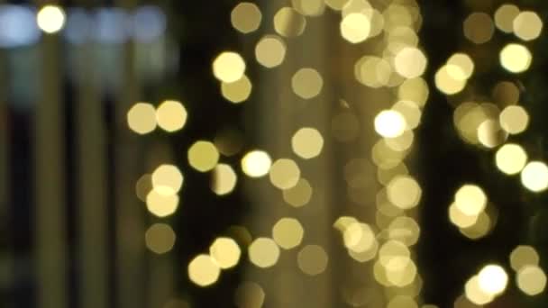 Golden Bokeh Lights Focus Animation sur fond noir. Fuites de lumière clignotante 