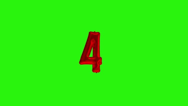 Number 4 four fourth year celebration red foil balloon floating on green — Stock Video