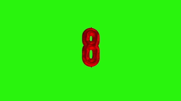 Number 8 eight eigthth year celebration red foil balloon floating on green — Stock Video