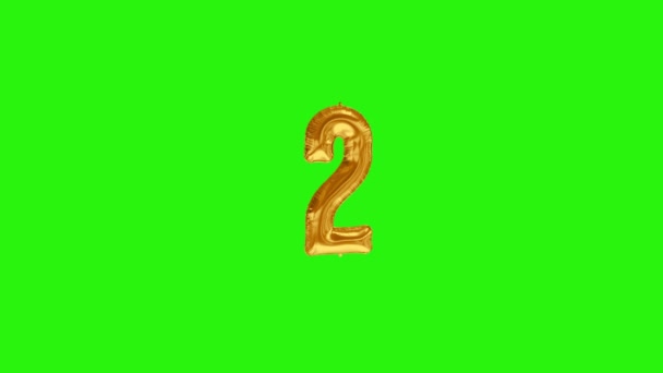 Number 2 two second year celebration gold foil balloon floating on green — Stock Video