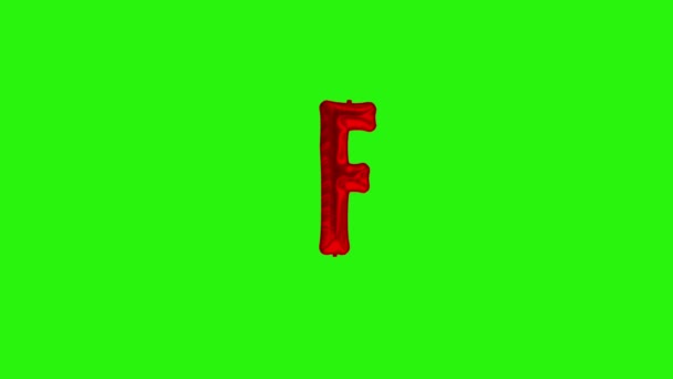 Κόκκινο γράμμα F. Κόκκινο αλουμινόχαρτο ήλιο μπαλόνι αλφάβητο επιπλέει στην πράσινη οθόνη — Αρχείο Βίντεο