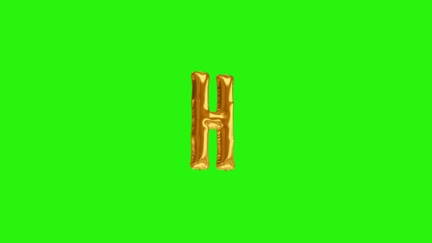 Letra dorada H. Alfabeto de globo de helio de lámina dorada flotando en pantalla verde — Vídeo de stock