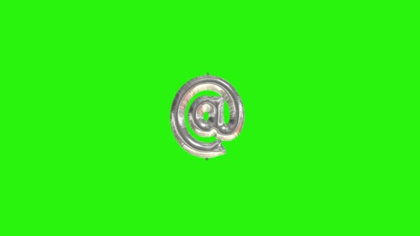 Silver symbol AT. Silver foil helium balloon symbol floating on green screen — Stock Video