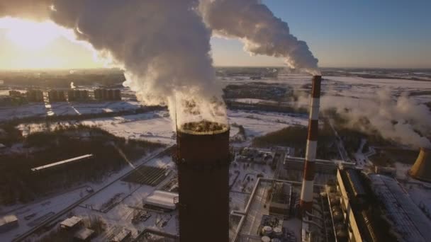 Smoking chimneys power station on sunset background in the winter. Aerial view — Stock Video