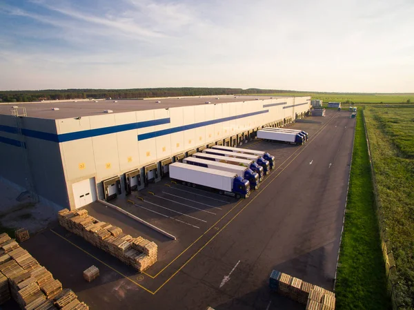 Distribution warehouse with trucks of different capacity — Stock Photo, Image