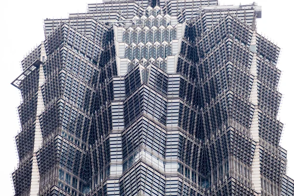 Shanghai, China - January 15, 2018: details of the facade of a modern skyscraper made of glass and steel closeup. Shanghai World Financial Center — Stock Photo, Image