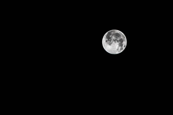 Full moon at black background — Stockfoto