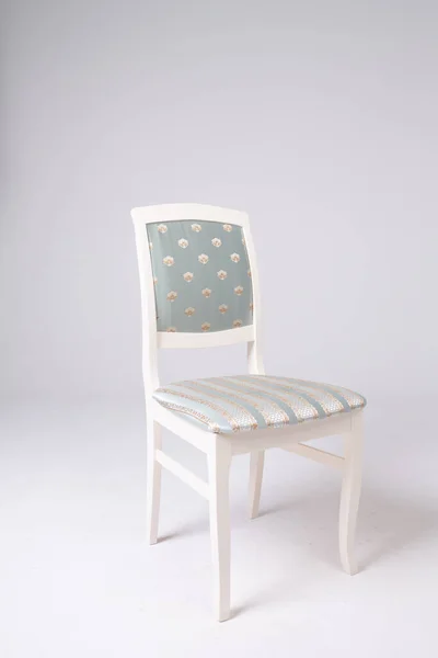 Single white chair with a soft striped seat on an isolated white background — Stock Photo, Image