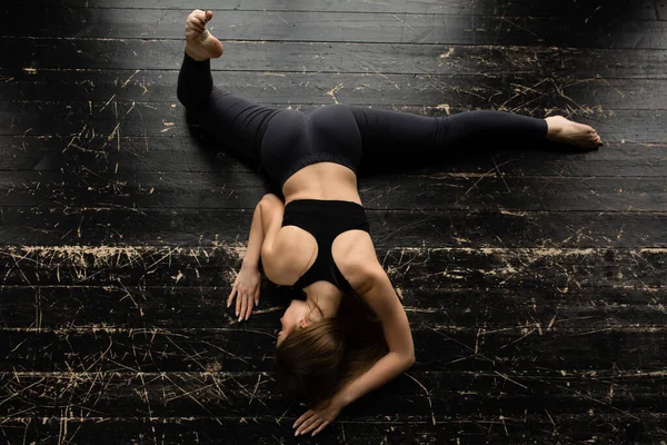 Attractive yoga instructor sat on the twine. Fitness instructors shows how to do the splits.