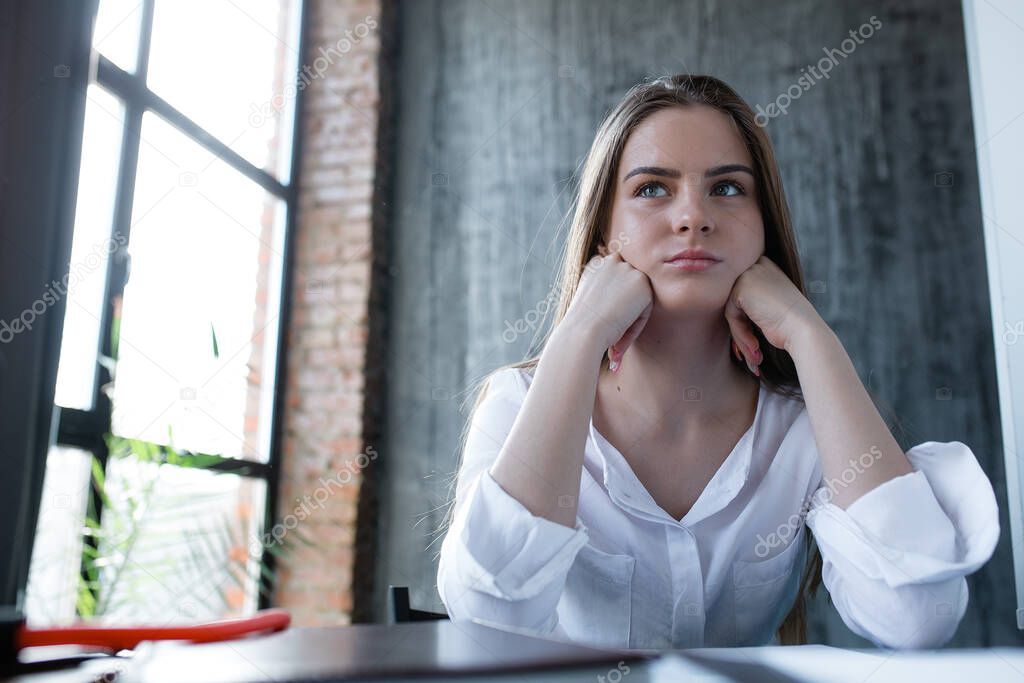 Company manager cries and looks offended because of an unfair reprimand and criticism from the director. Stress in a large company