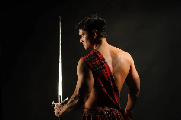 The hot soldier wears a highlander outfit — Stock Photo, Image