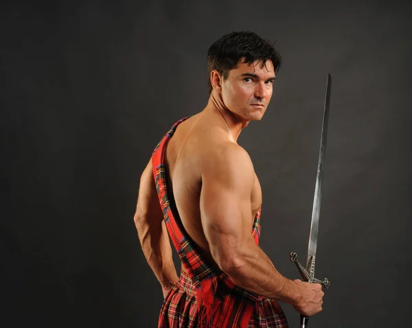 The hot soldier wears a highlander outfit — Stock Photo, Image